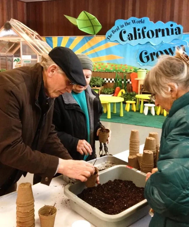 seed starting in cowpots at an earth day event