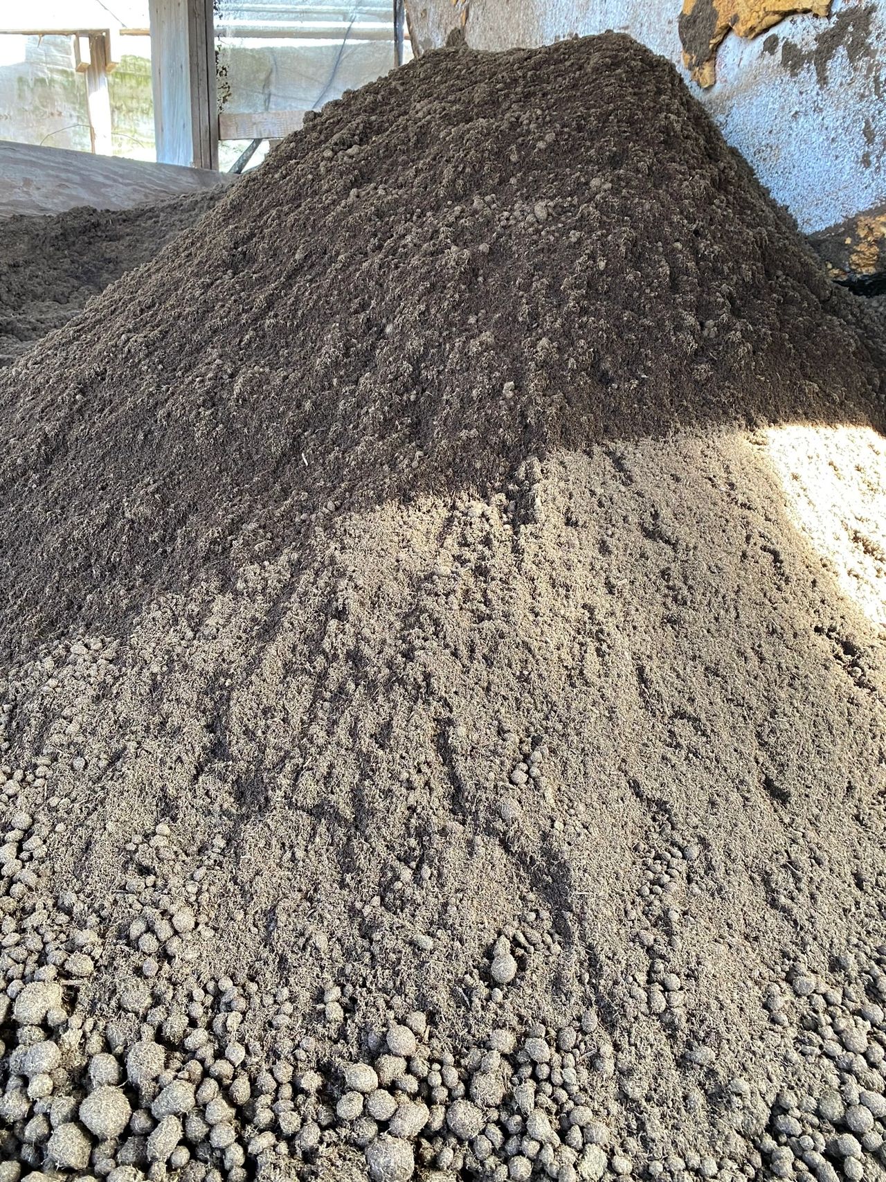 pile of completed compost at Freund's Farm this manure is ready to be turned into a cowpot